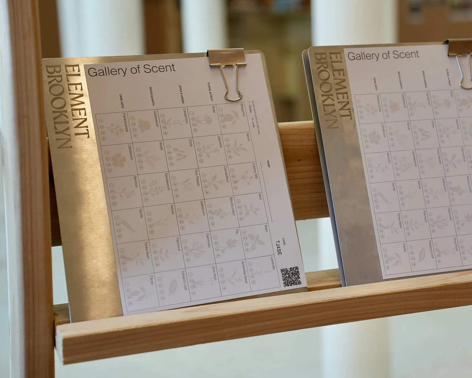 Gallery of Scent scorecards on a wooden ledge